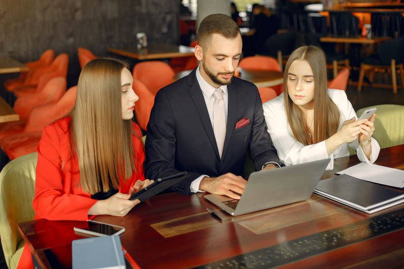 Professionals working on outsourcing contracts